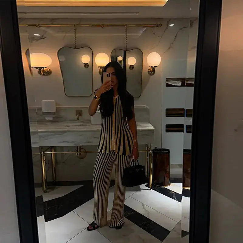 Full view of the chic striped knit ensemble, perfect for business casual women.