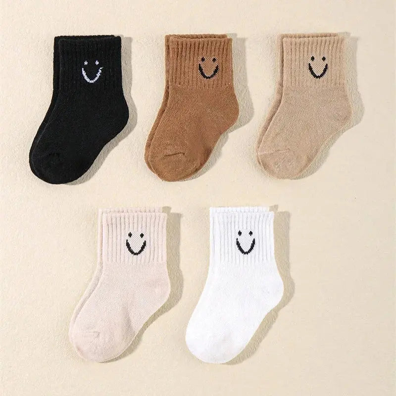Durable elastic kids' socks featuring a joyful smile pattern for happy little feet.