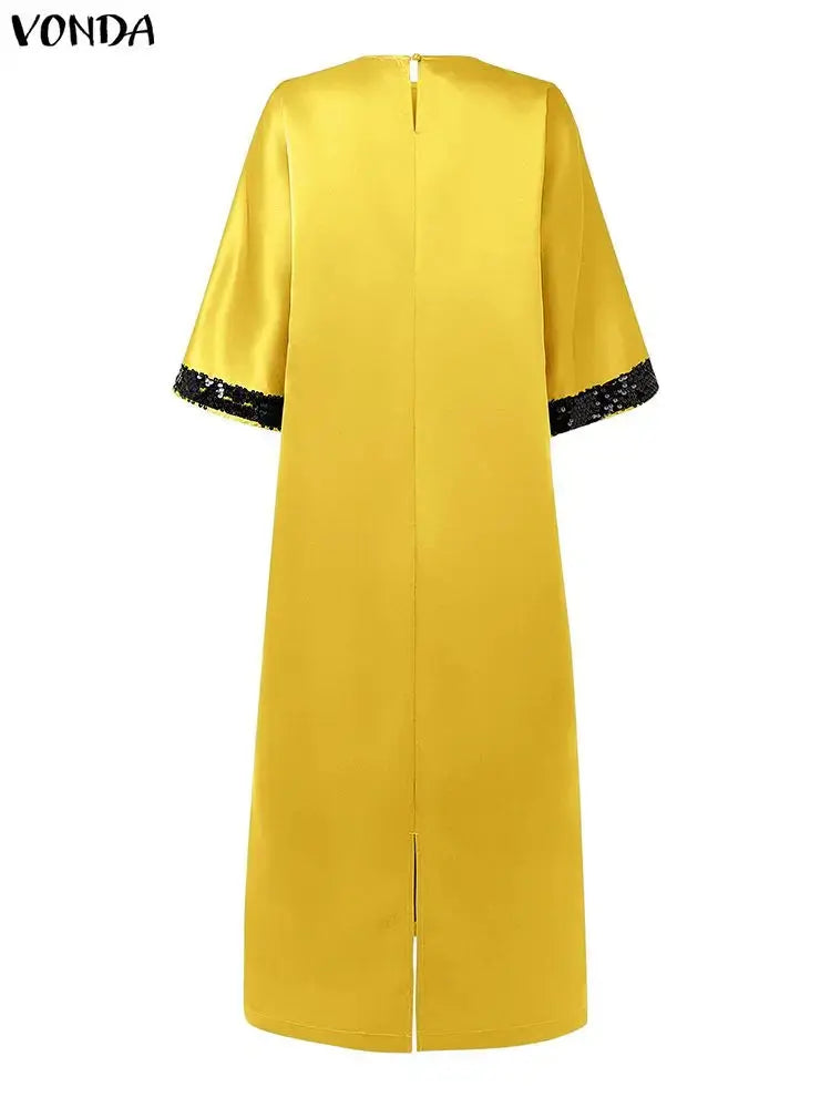 Back view of the flowing satin dress, highlighting its loose fit and graceful movement.