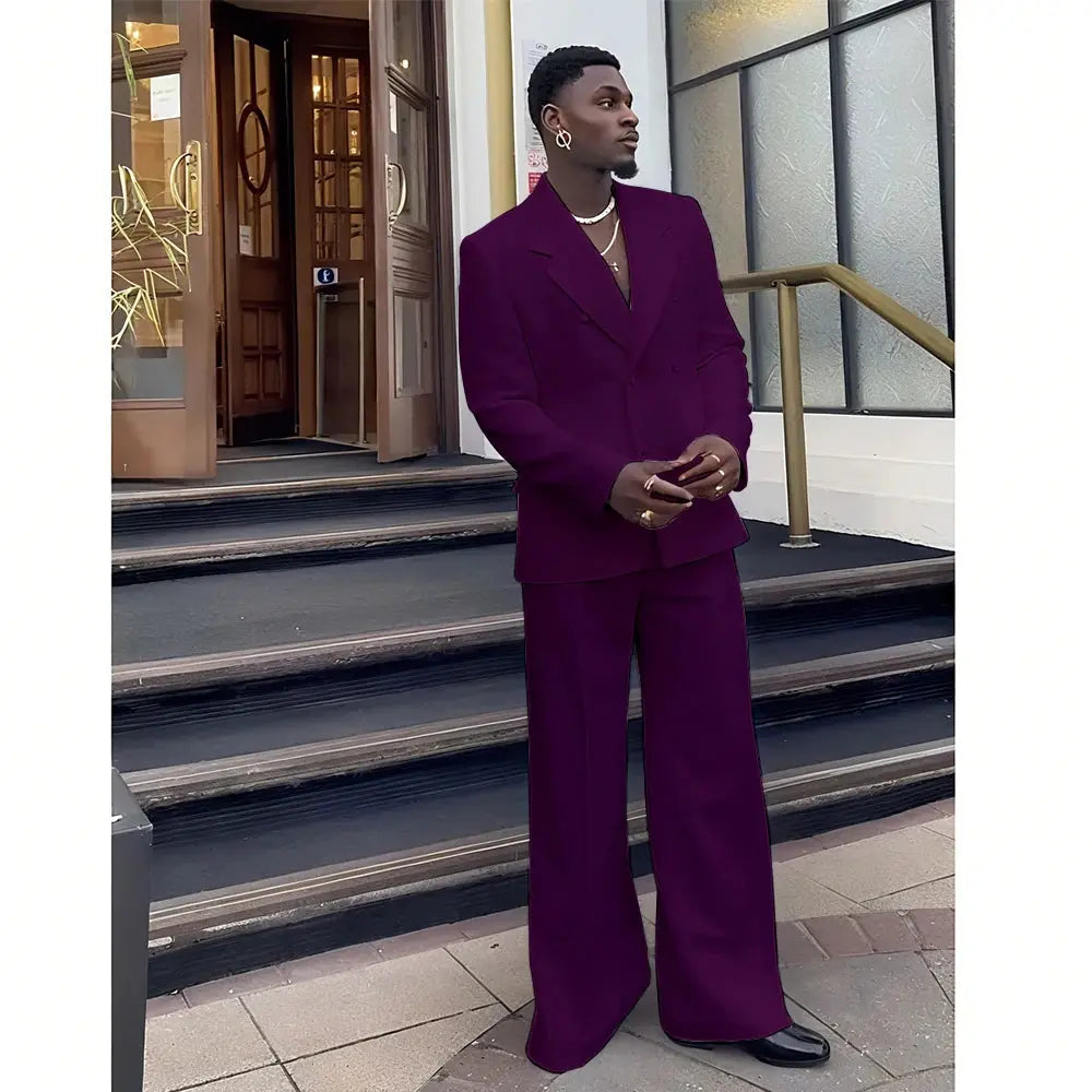 Black double-breasted suit on a hanger, ready for a formal occasion.