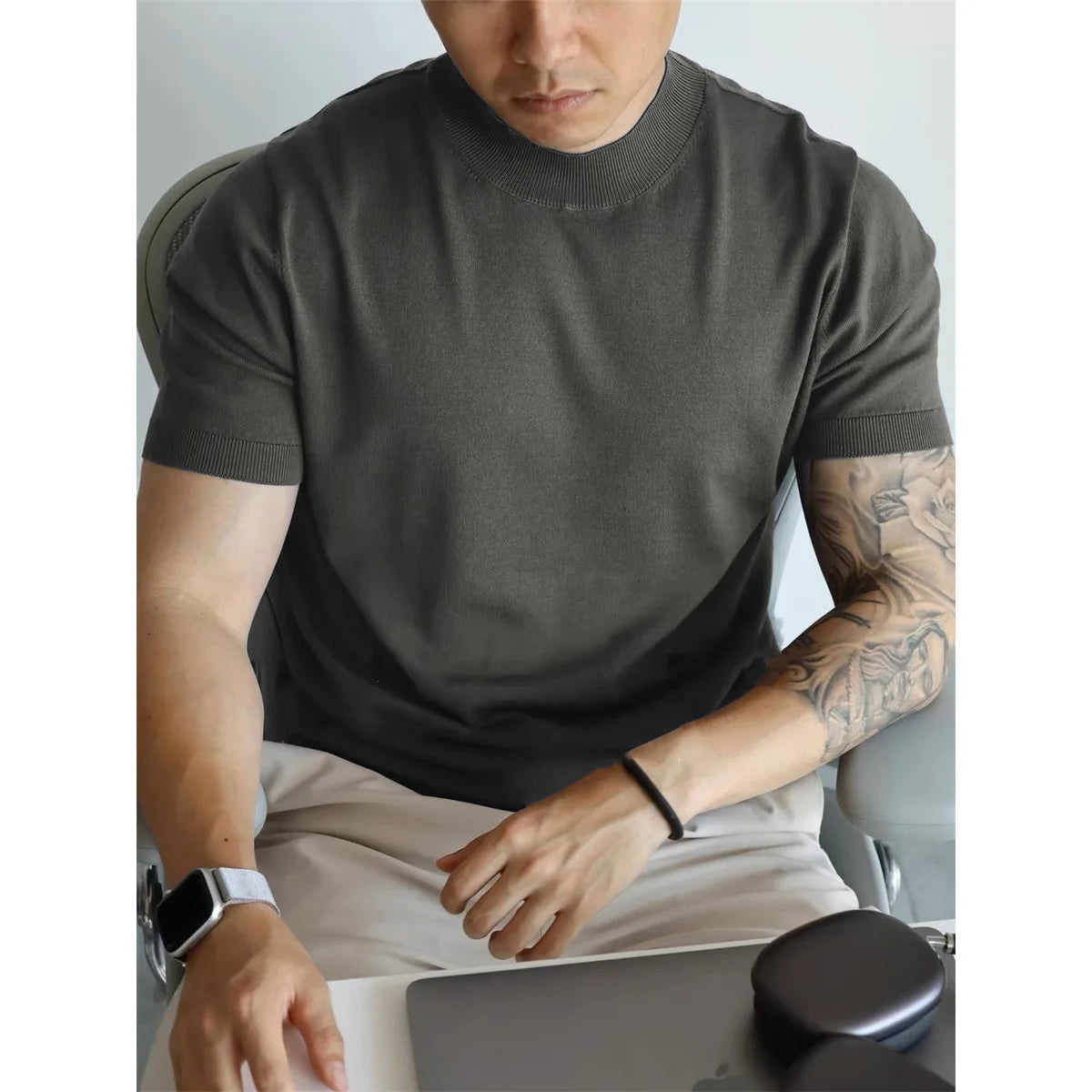 Office setting with a man in the breathable tee, perfect for business casual meetings.