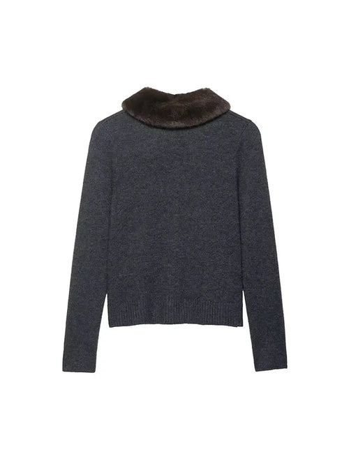 Close-up of the button detail on the Autumn Whisper Cardigan, showcasing its chic design.