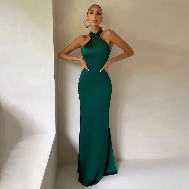 Back view of the backless mermaid gown highlighting the dramatic silhouette and zipper closure.