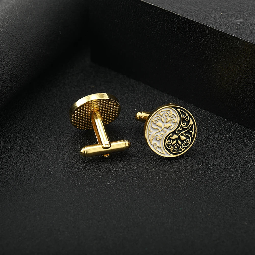 Yin Yang cufflinks in polished metal with black and white enamel design.