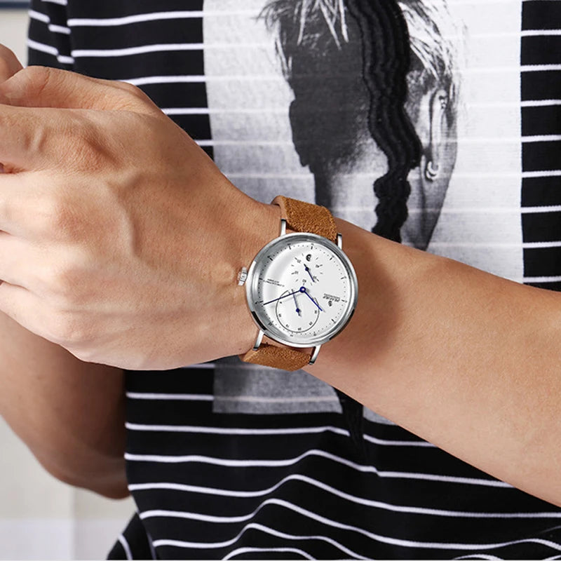 Lifestyle image of the watch worn by a man in a boardroom setting.