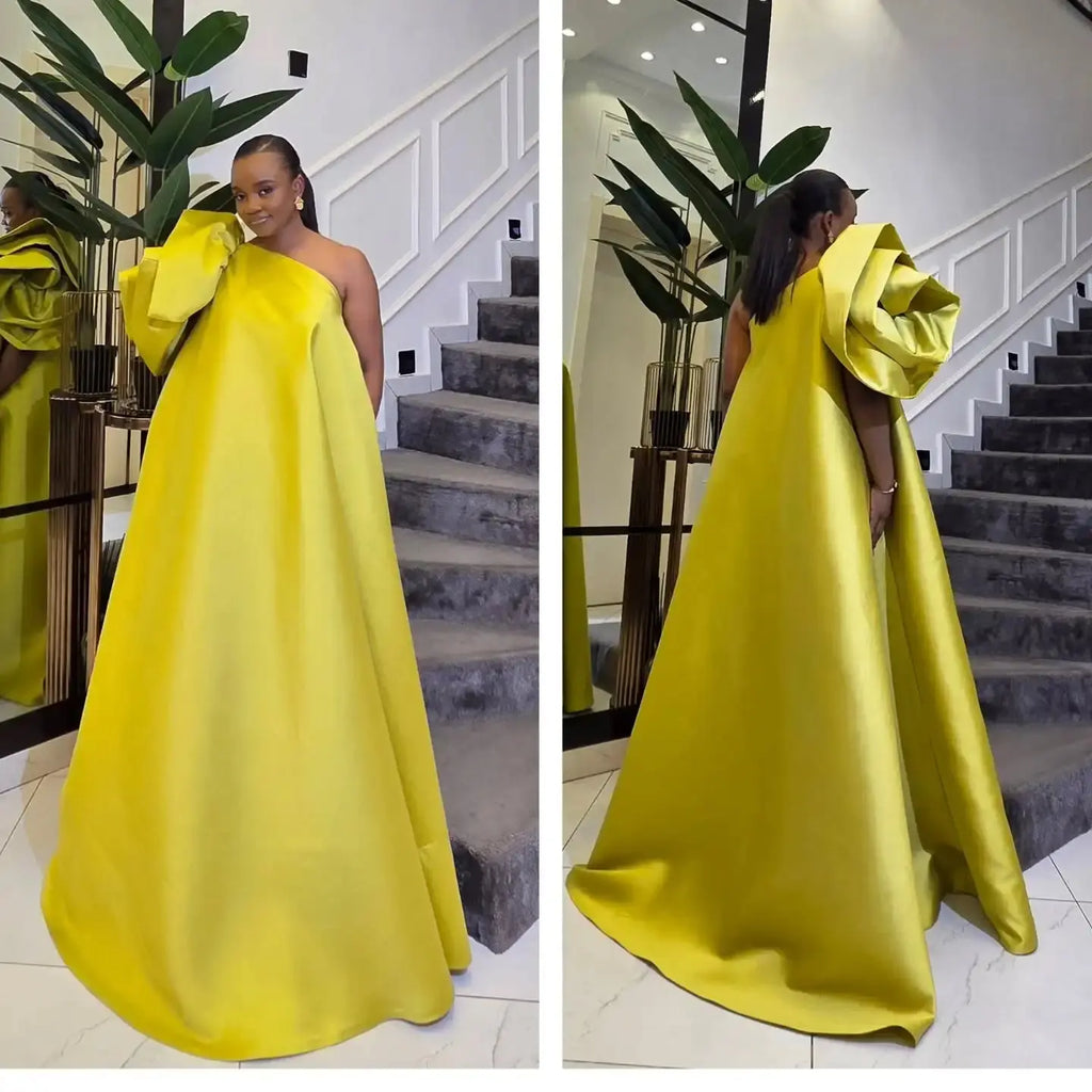 Model wearing the enchanting rose gala gown with a detachable train, perfect for formal events.