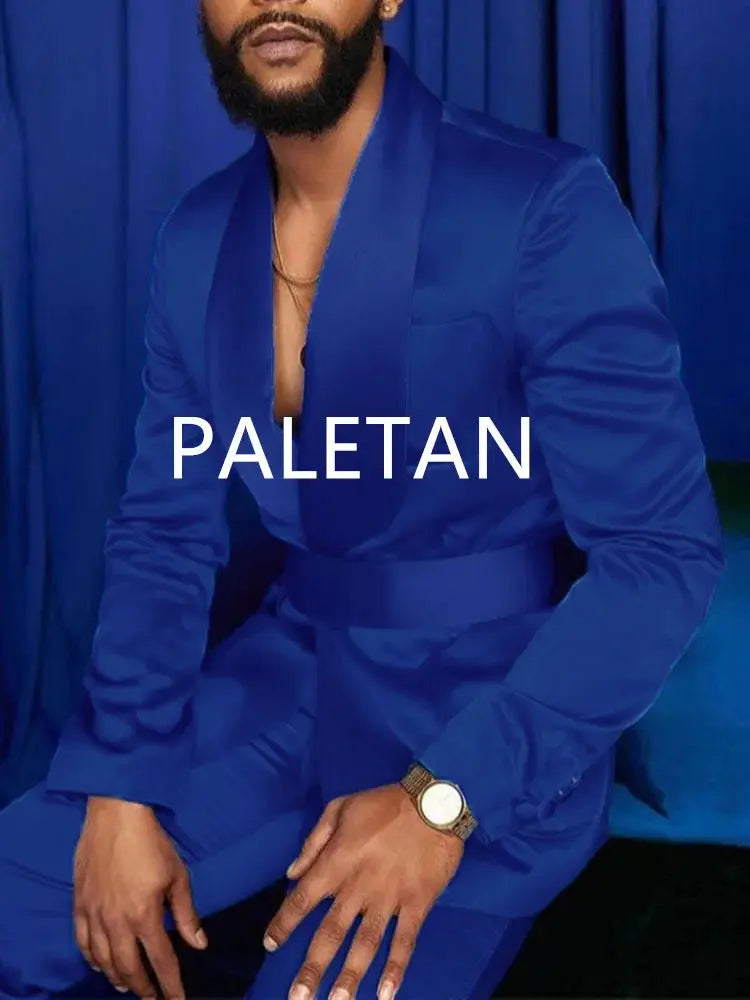 Royal blue tuxedo with stylish accessories for a complete look.