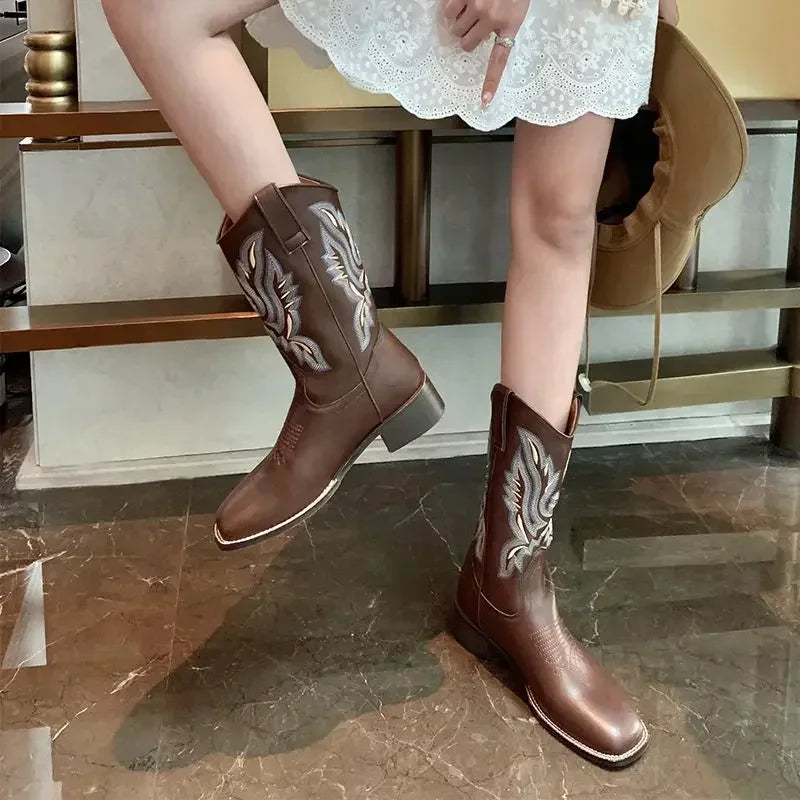Square toe Western boots with artisan embroidery and premium leather construction