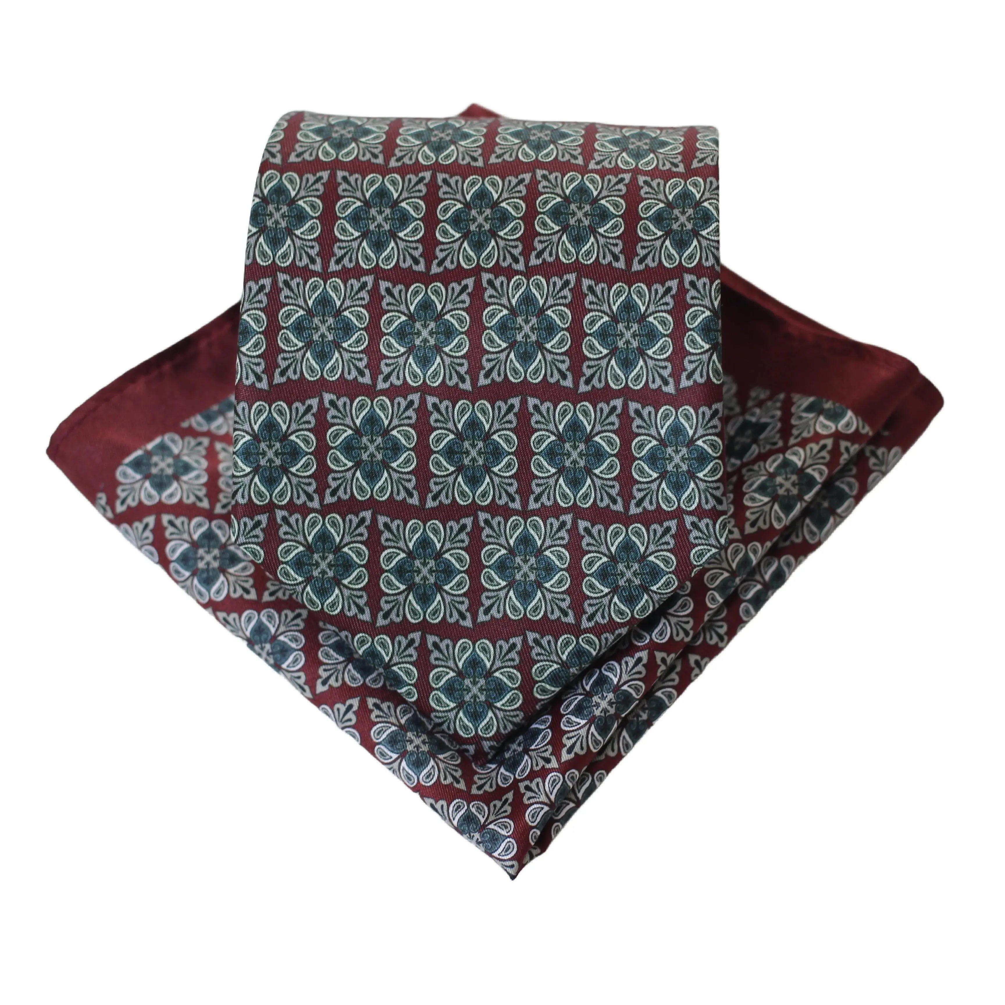 Orange geometric tie styled with a blazer, ideal for boardroom attire.