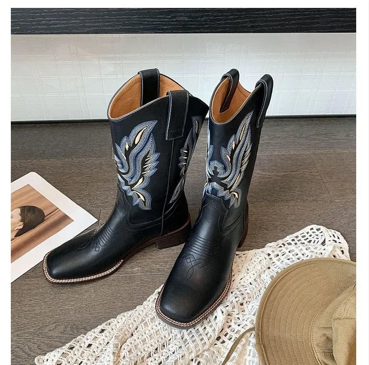 Mid-calf Western boots featuring premium leather and authentic embroidered detailing
