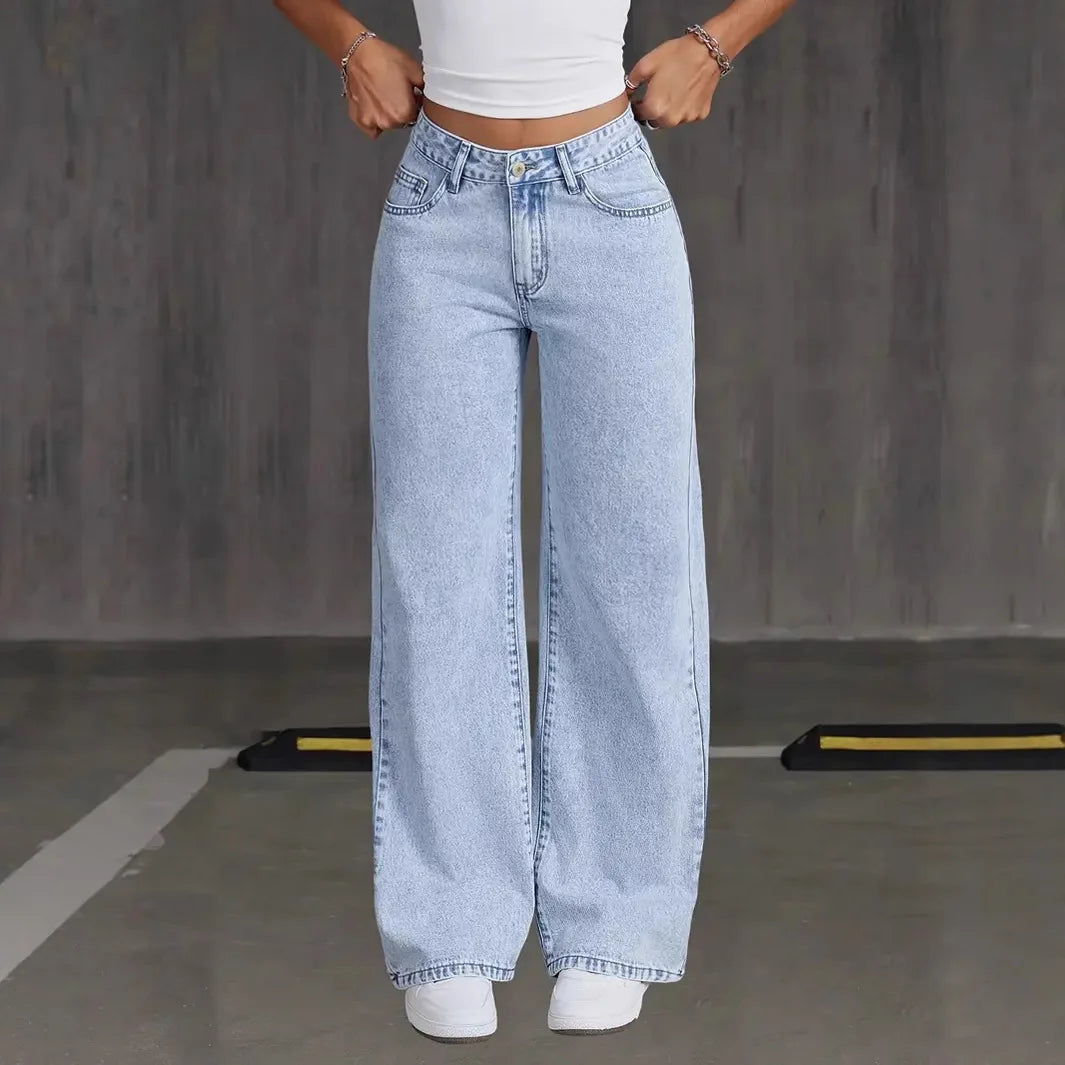 Wide-leg jeans in a sunny outdoor setting, ideal for spring fashion trends.