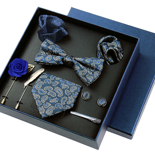 Elegant formal accessory collection featuring coordinated tie, cufflinks, and pocket square