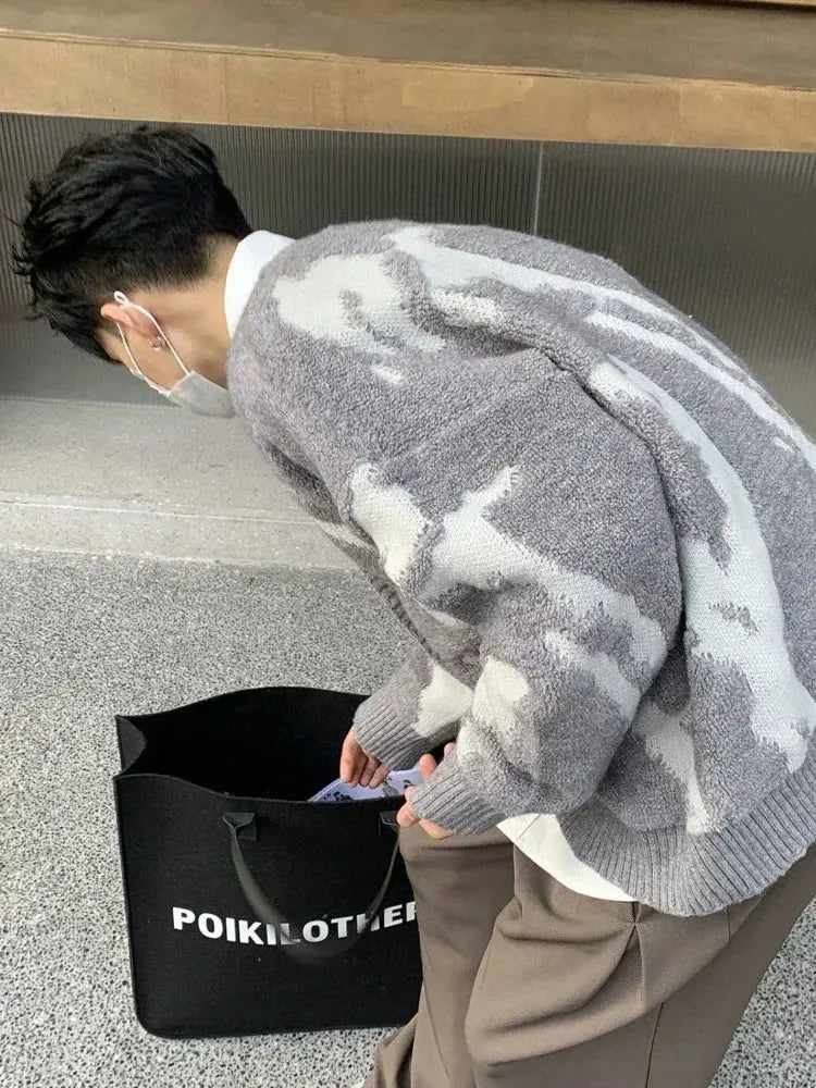 Close-up of Urban Poet cardigan's tasteful button accents and V-neck style.