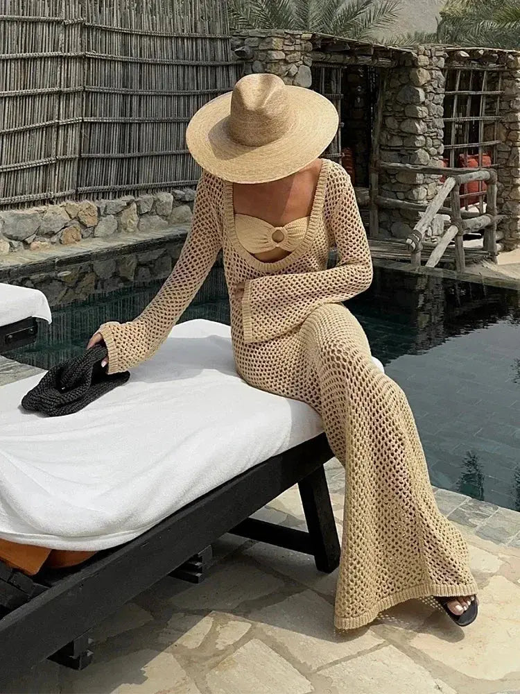 Model wearing the Whisper of Waves Crochet Maxi Cover-Up at the beach, embodying summer elegance and style.