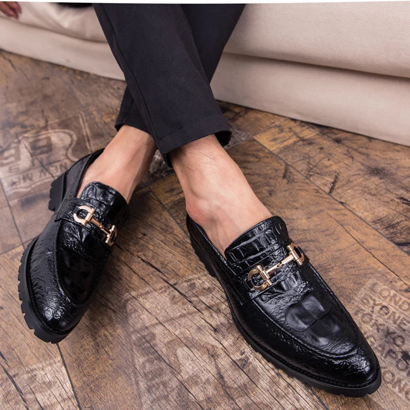 Durable rubber outsole of croc-embossed loafers for reliable traction.