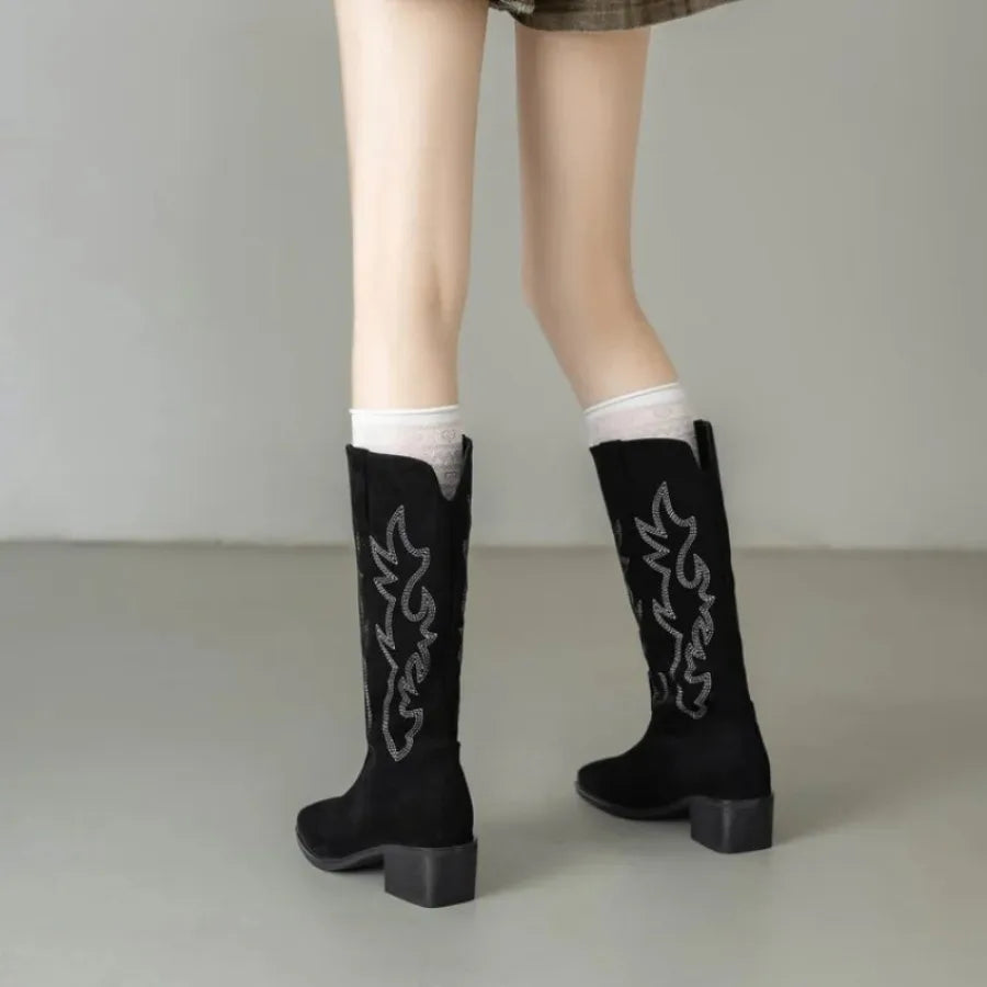 Tan leather knee-high boots with traditional Western embroidery motifs
