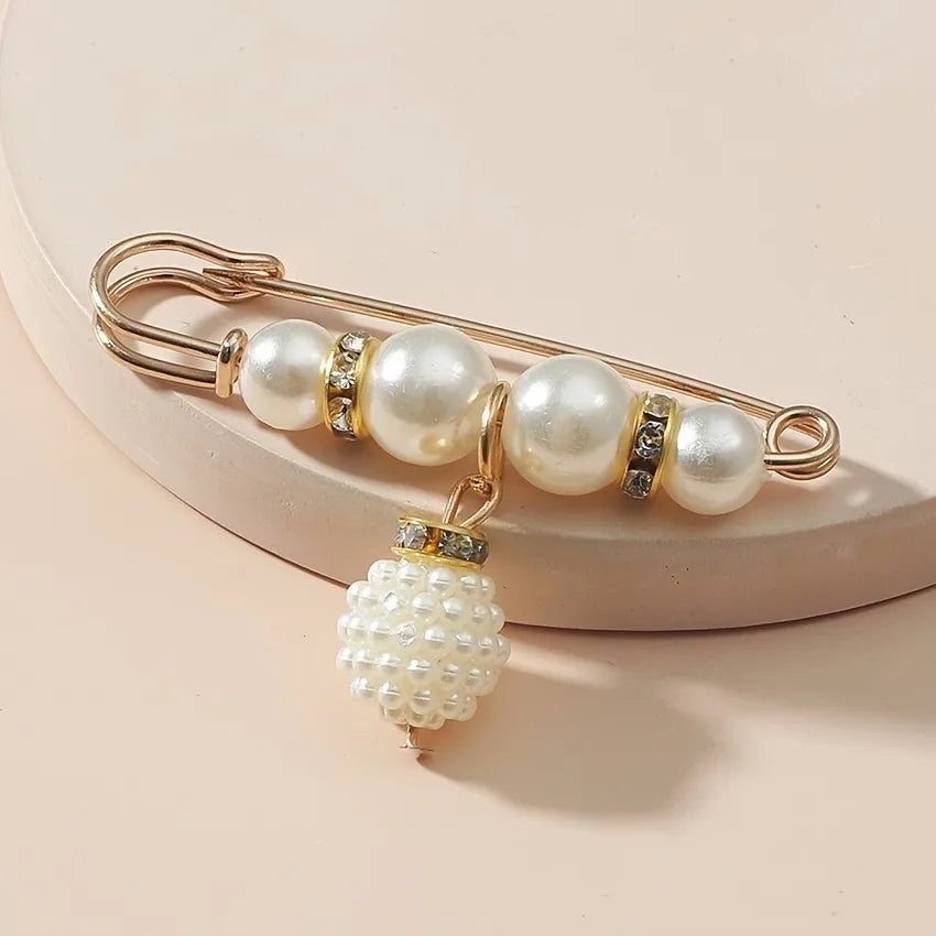 Versatile pearl pins perfect for enhancing blazers, scarves, and hats.