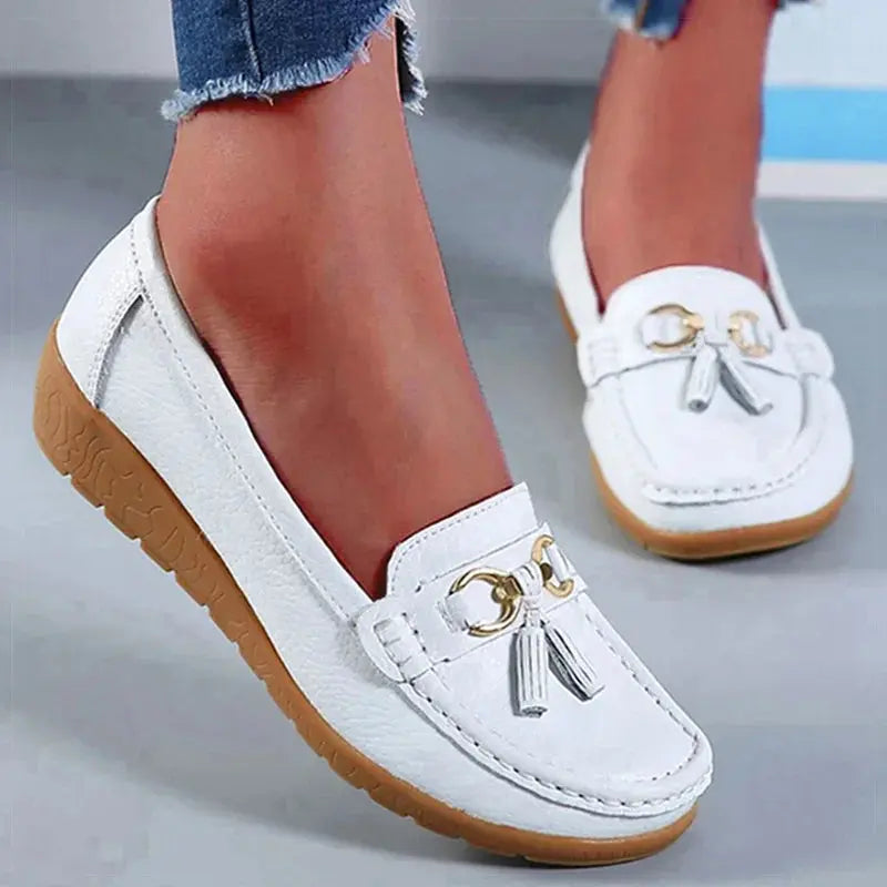 Comfortable white sneakers featuring a cushioned insole for support.