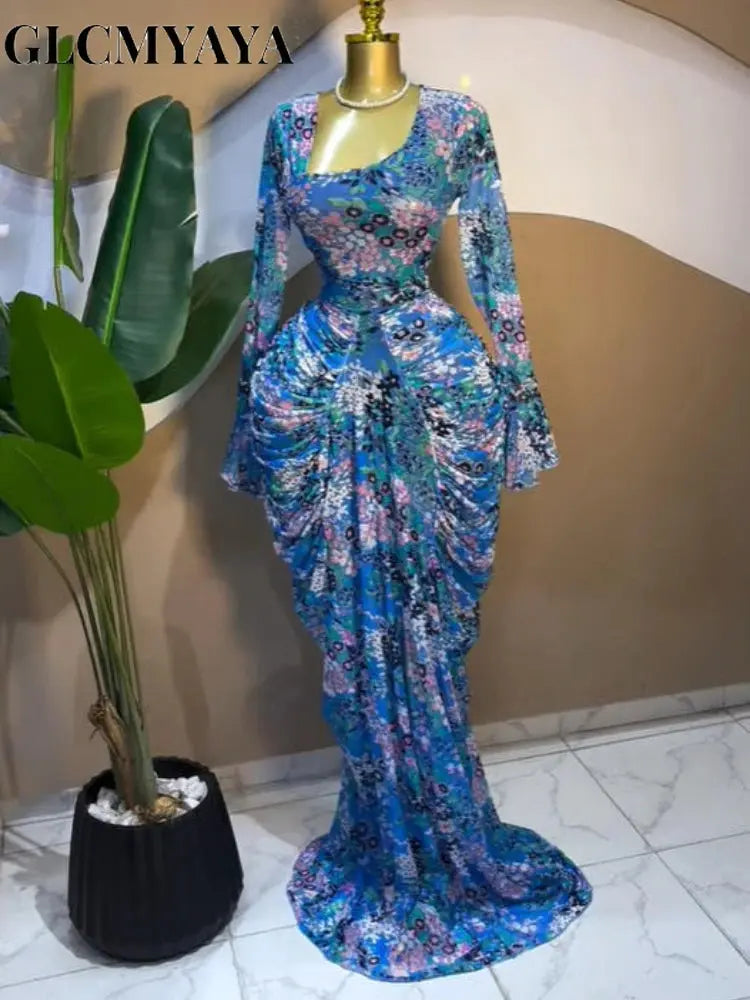 Side view of the Floral Whisper Asymmetrical Dress with long sleeves and bold floral design.