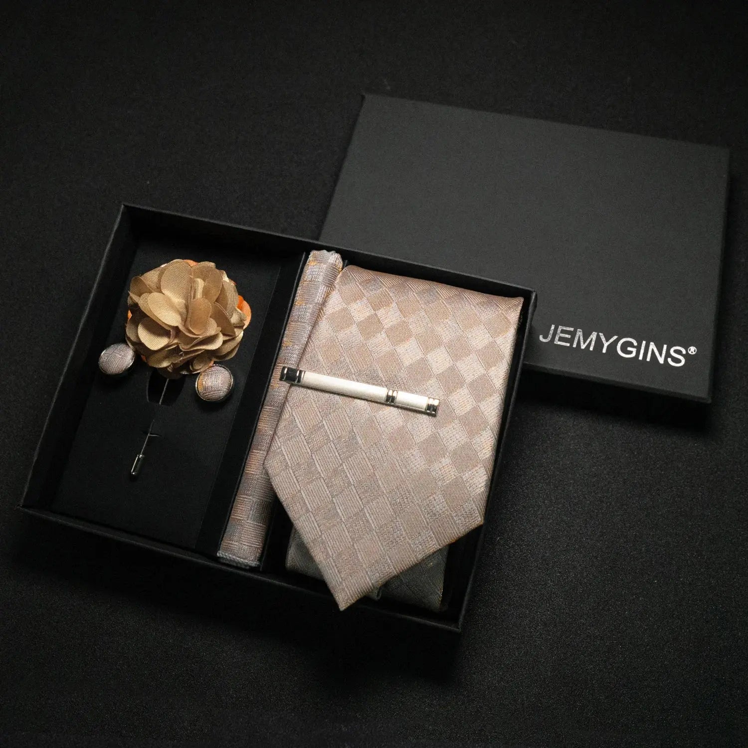Wine-red paisley tie set ready for a business meeting.