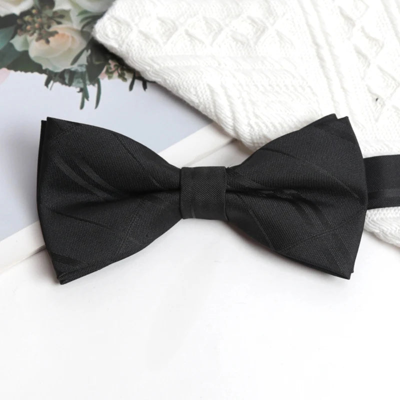 Double-layered Charisma Bowtie in black, adding depth to formal attire.