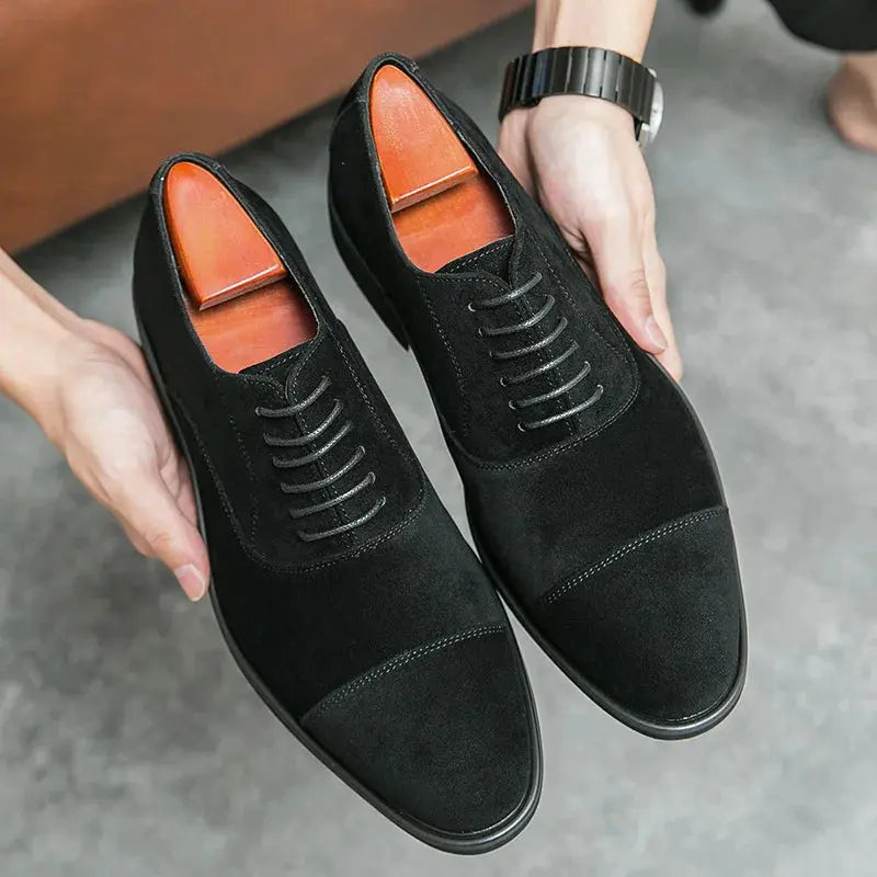 Brown suede oxfords styled for a wedding, illustrating their luxury and refined design.
