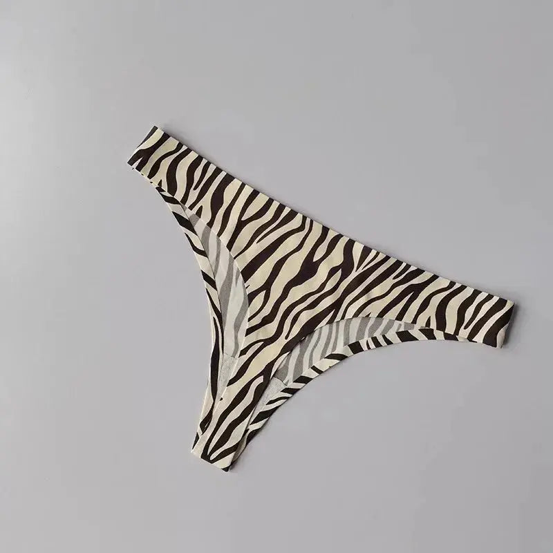 Flat lay of ice silk thong with fitness accessories, ideal for active lifestyle.