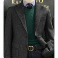 Back view of the herringbone blazer, highlighting its sleek silhouette.
