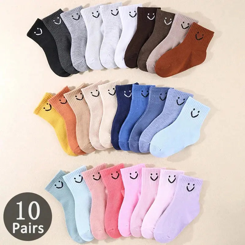 Colorful kids' socks with cheerful smiling faces, perfect for everyday adventures.