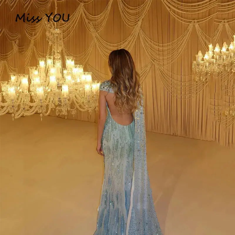Close-up of hand-beaded details on the enchanting blue mermaid gown.
