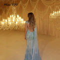 Close-up of hand-beaded details on the enchanting blue mermaid gown.