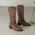 Knee-high cowboy boots with premium leather and decorative stitching