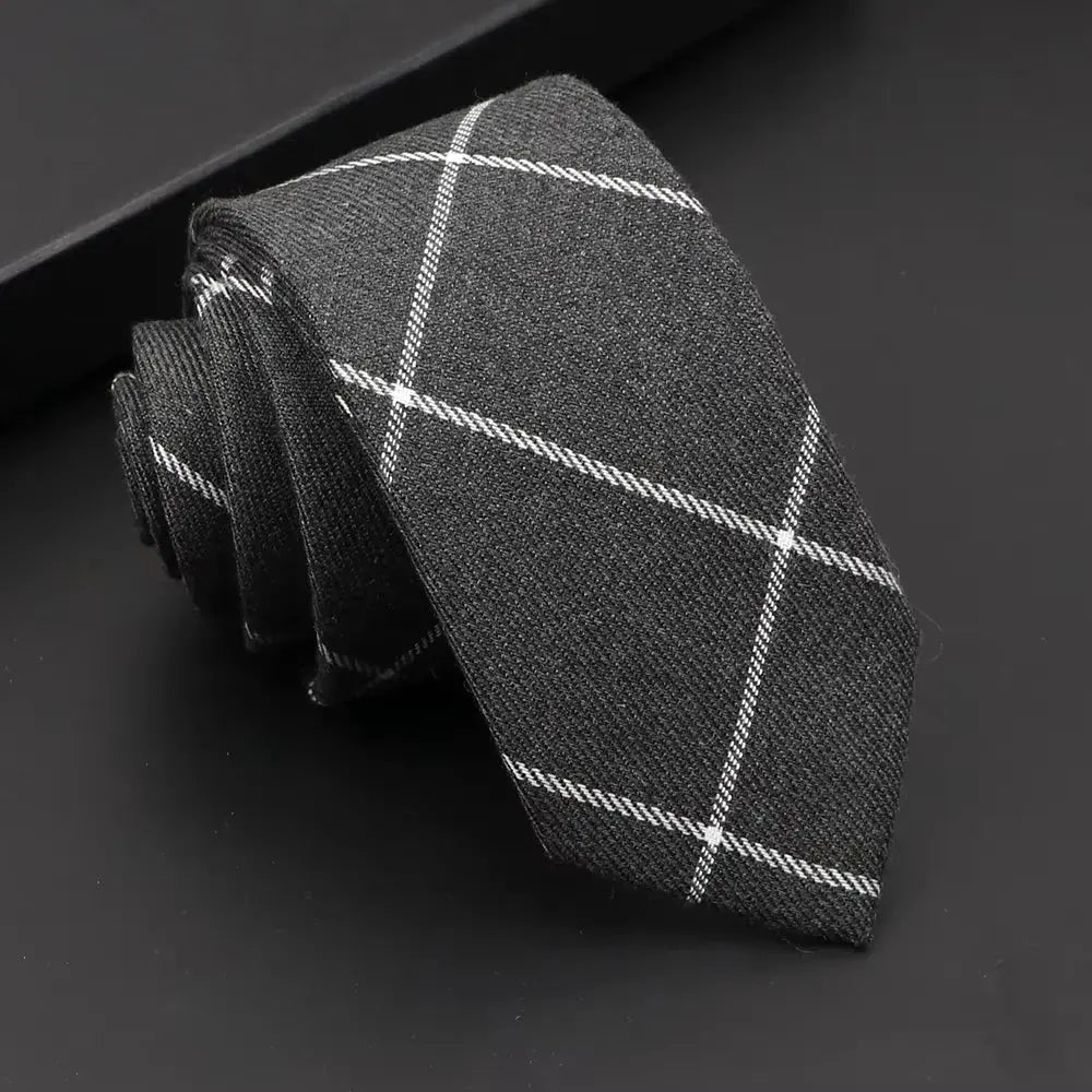 Versatile solid black tie, perfect for any formal event.