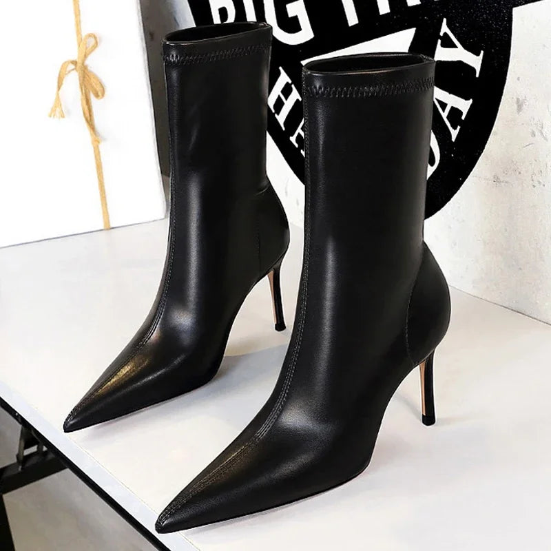 Pointed stiletto leather mid-calf boots in black with sleek silhouette