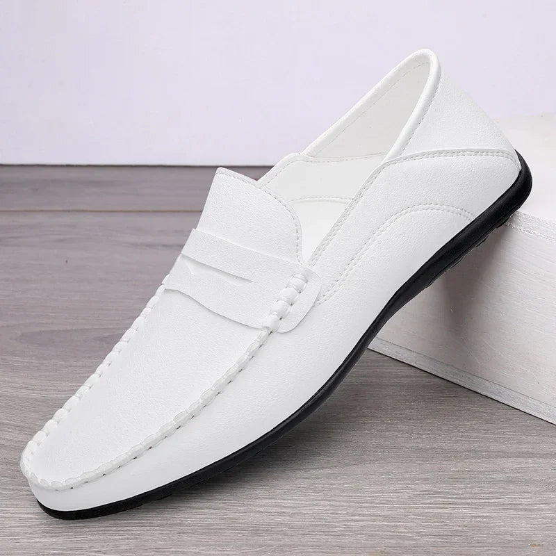 Brown split leather slip-on loafers with classic design for men on white background