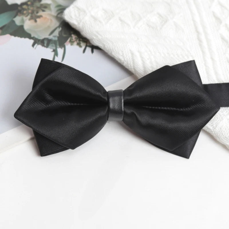 Black Charisma Bowtie on a mannequin, showcasing its charismatic appeal and versatility.