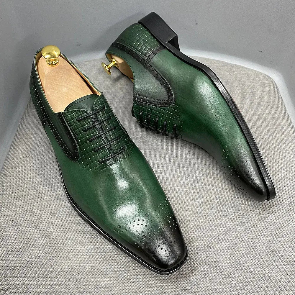 Top-down view of handcrafted green Oxford shoes with laces.