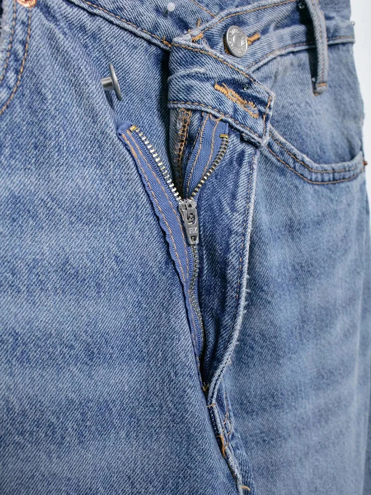 Back view of high-waisted wide-leg jeans highlighting the unique fit.