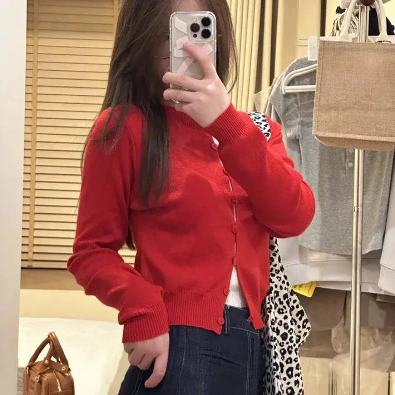Model wearing the Whisper-Soft Cardigan, styled casually with jeans for a chic autumn look.