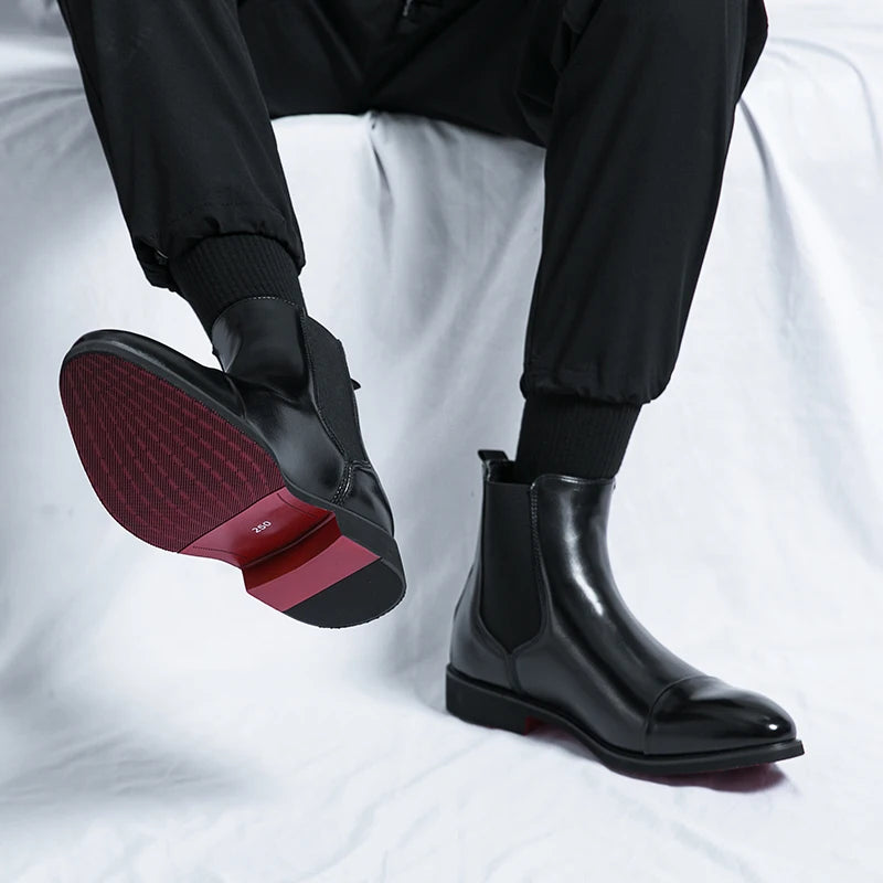 Ankle-height slip-on boots with polished finish for boardroom meetings