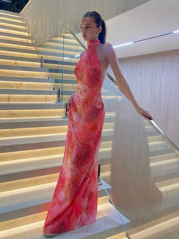 Stretchy printed bodycon dress with halter top and backless detail for confident night out style