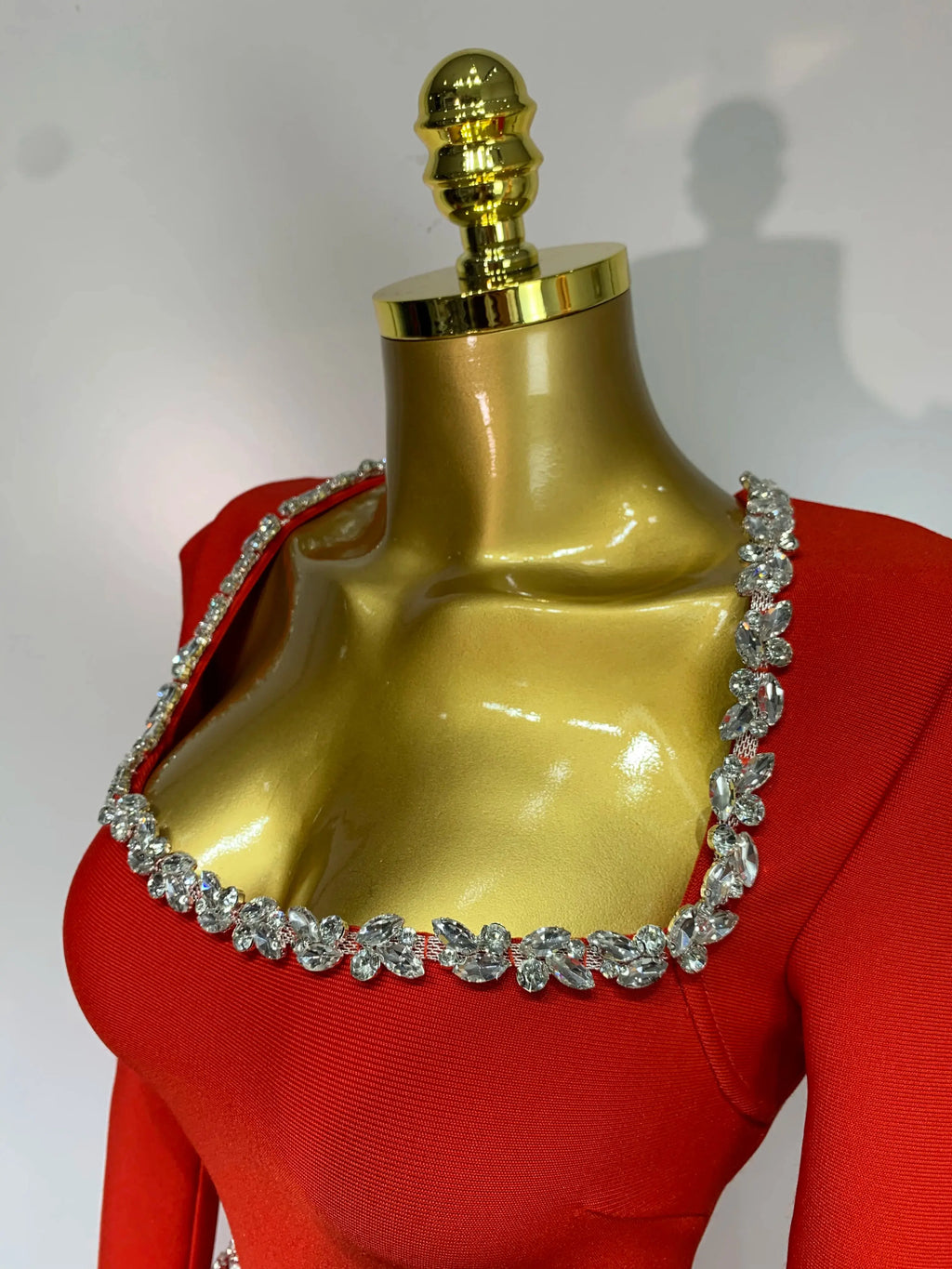 Long sleeve red sheath dress featuring a square collar and zippered back for a chic fit.