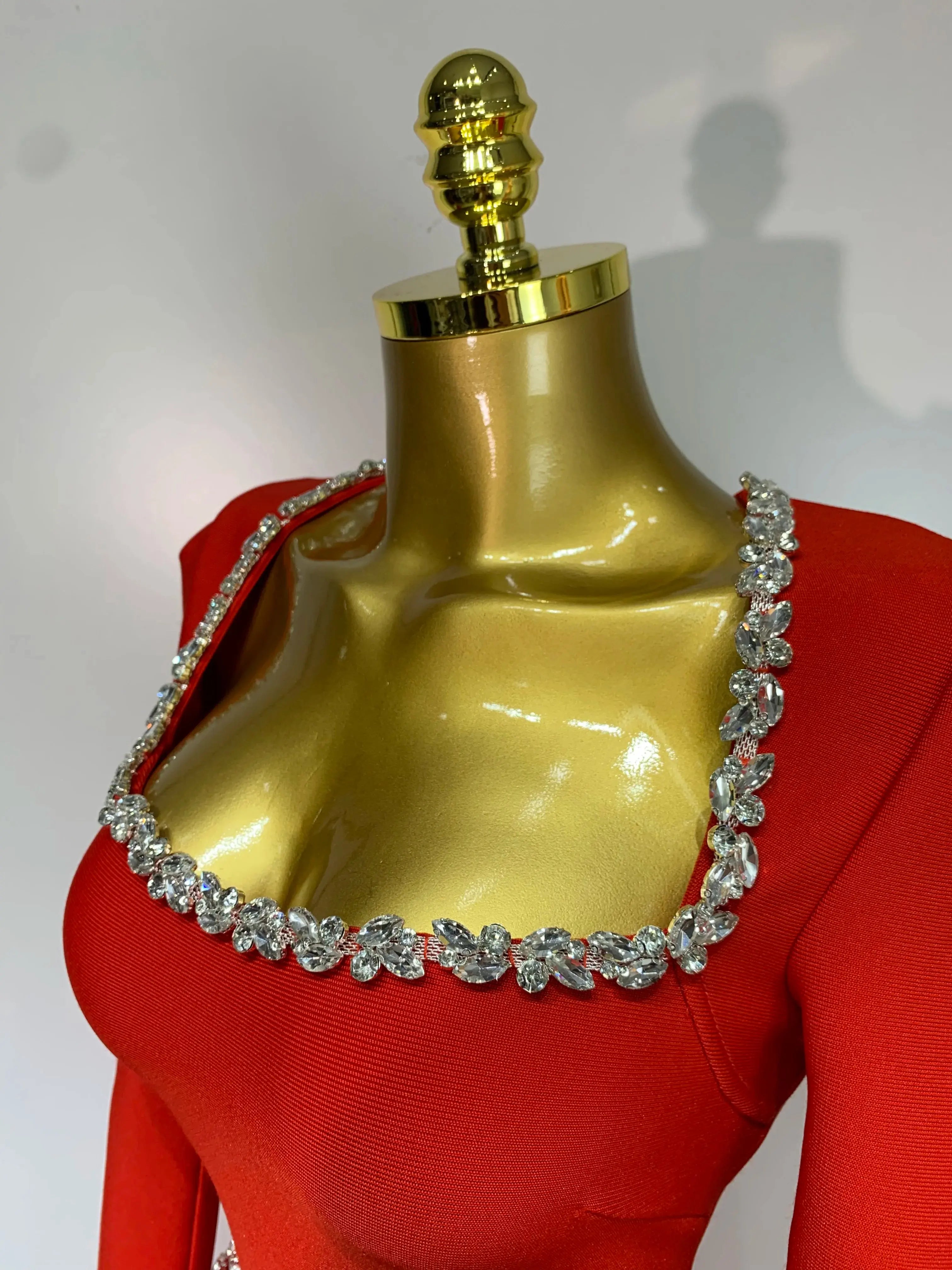 Long sleeve red sheath dress featuring a square collar and zippered back for a chic fit.