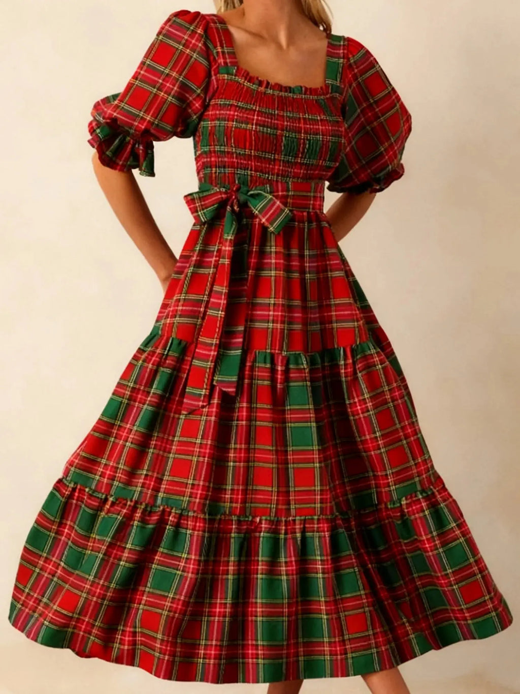 Close-up of the plaid fabric on the Captivate in Plaid dress, showcasing its festive colors.