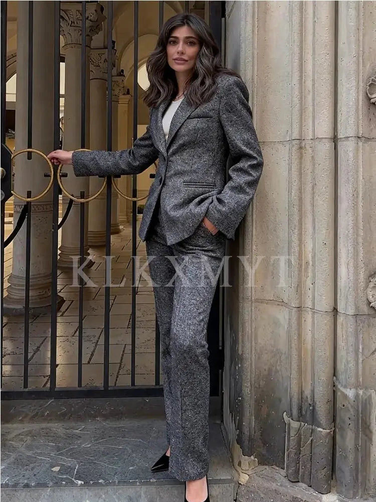 Single-breasted black suit jacket, showcasing elegant design.