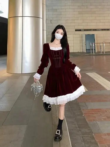 Elegant display of the Midnight Whispers Velvet Dress on a mannequin, showcasing its vintage charm.