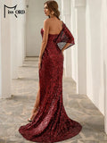 Detail shot of the gown's luxurious fabric and intricate sequin placement.
