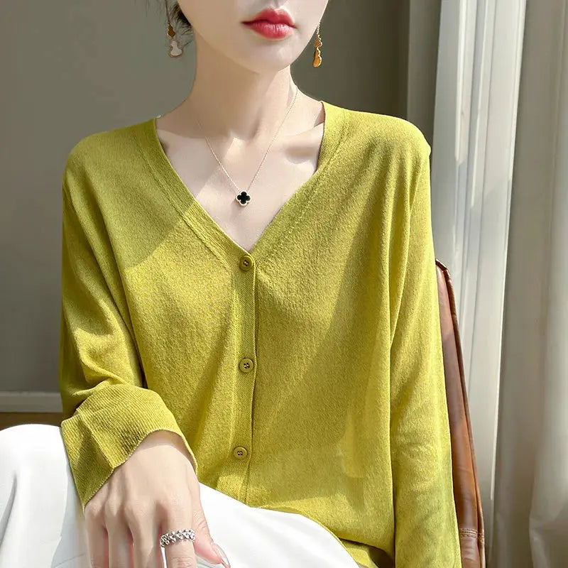 Breeze Whisper Cardigan paired with summer accessories, highlighting its casual chic appeal.