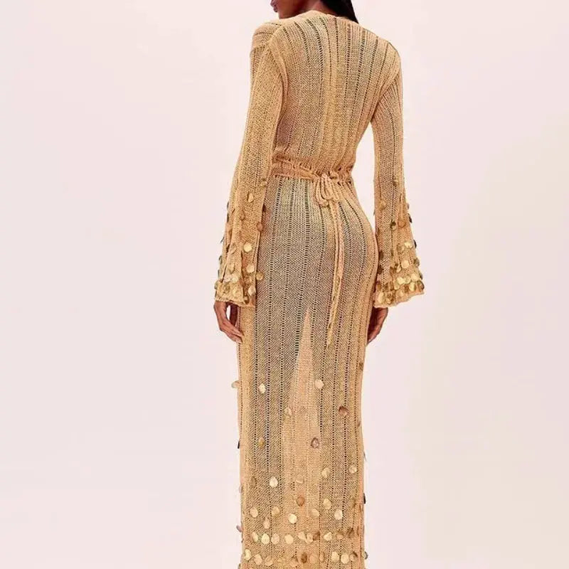 Back view of the Midnight Shimmer Maxi dress, emphasizing the flowing fabric and elegant design.
