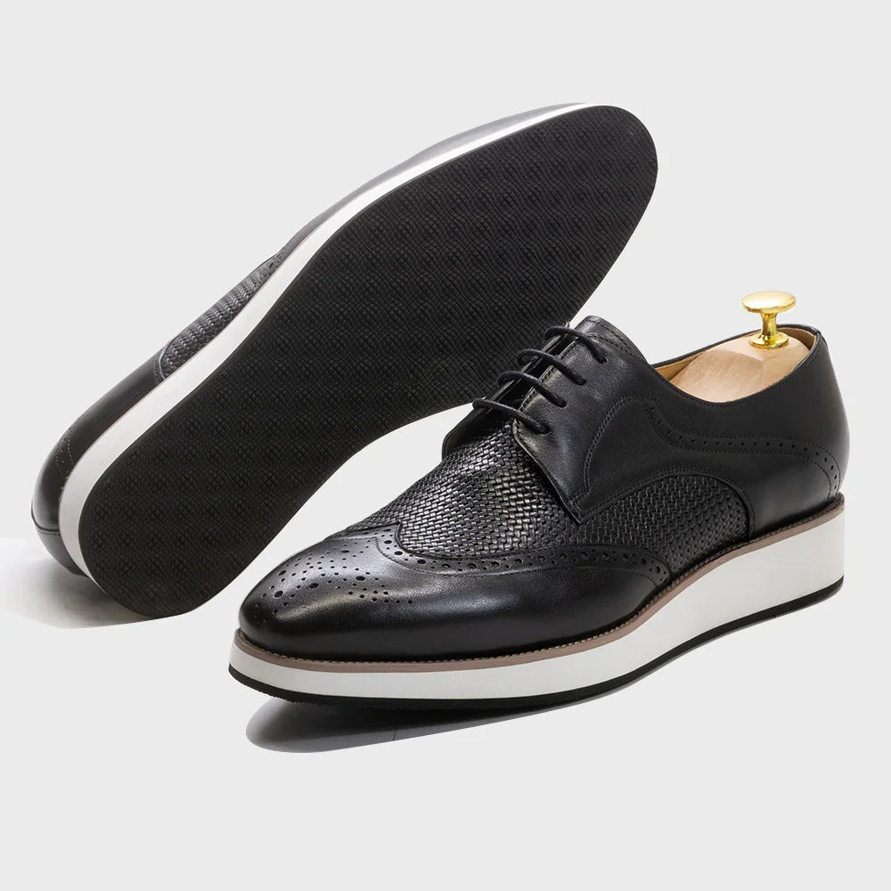 Handcrafted dark brown leather derby shoes featuring traditional brogue patterns and lace-up closure